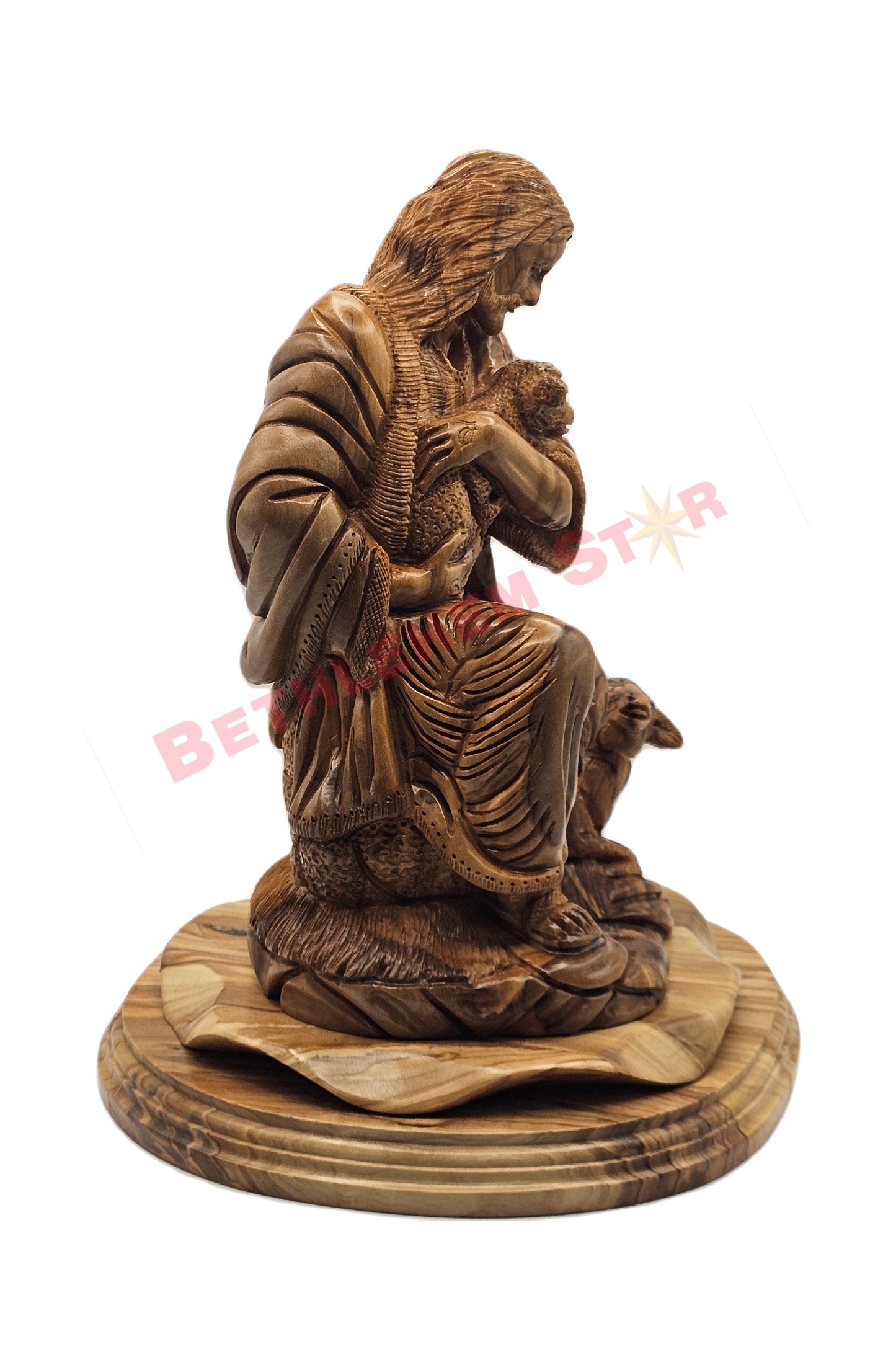 Olive wood hand carved of The Good Shepherd resting on rock