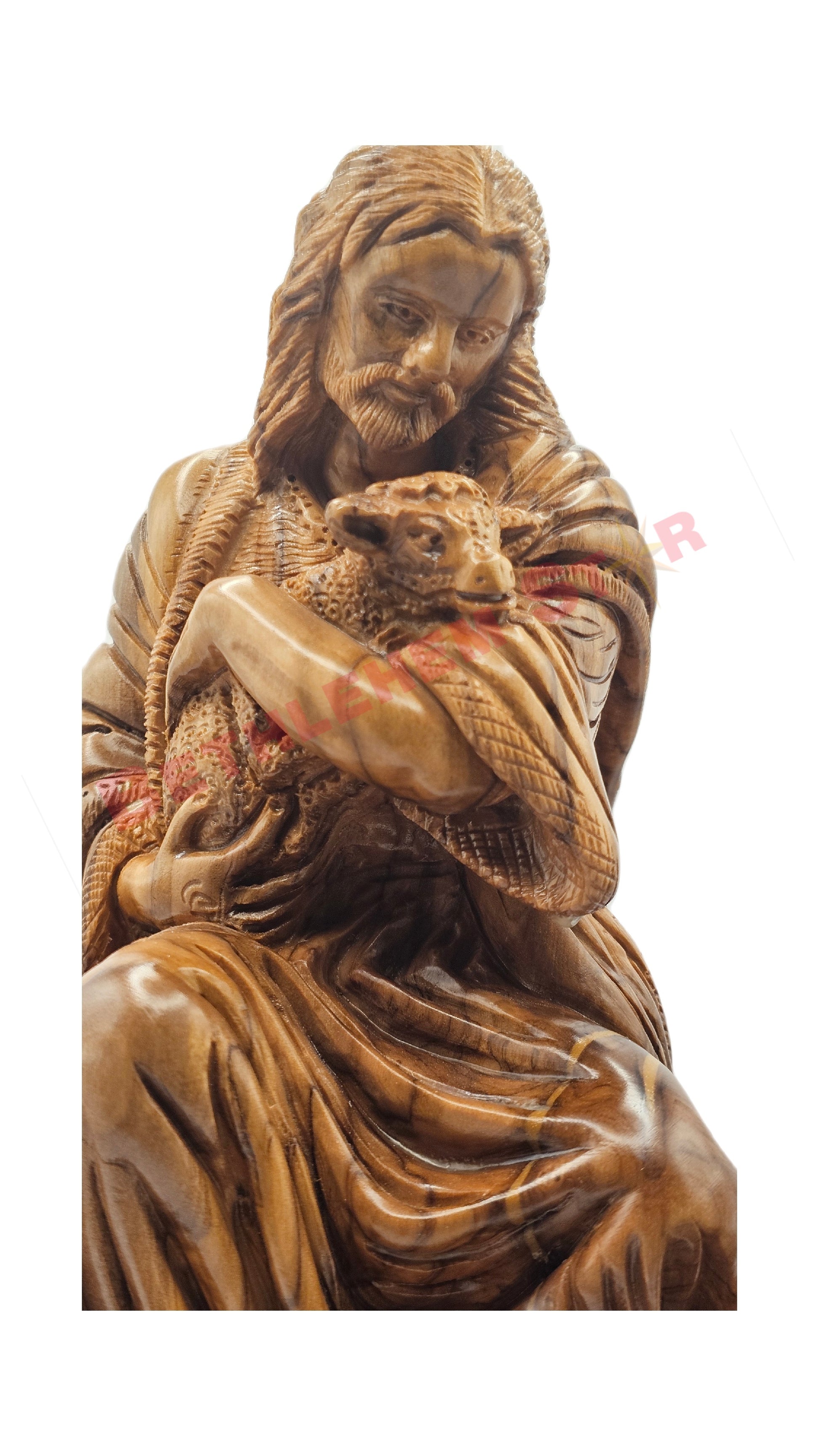 Olive wood hand carved of The Good Shepherd resting on rock