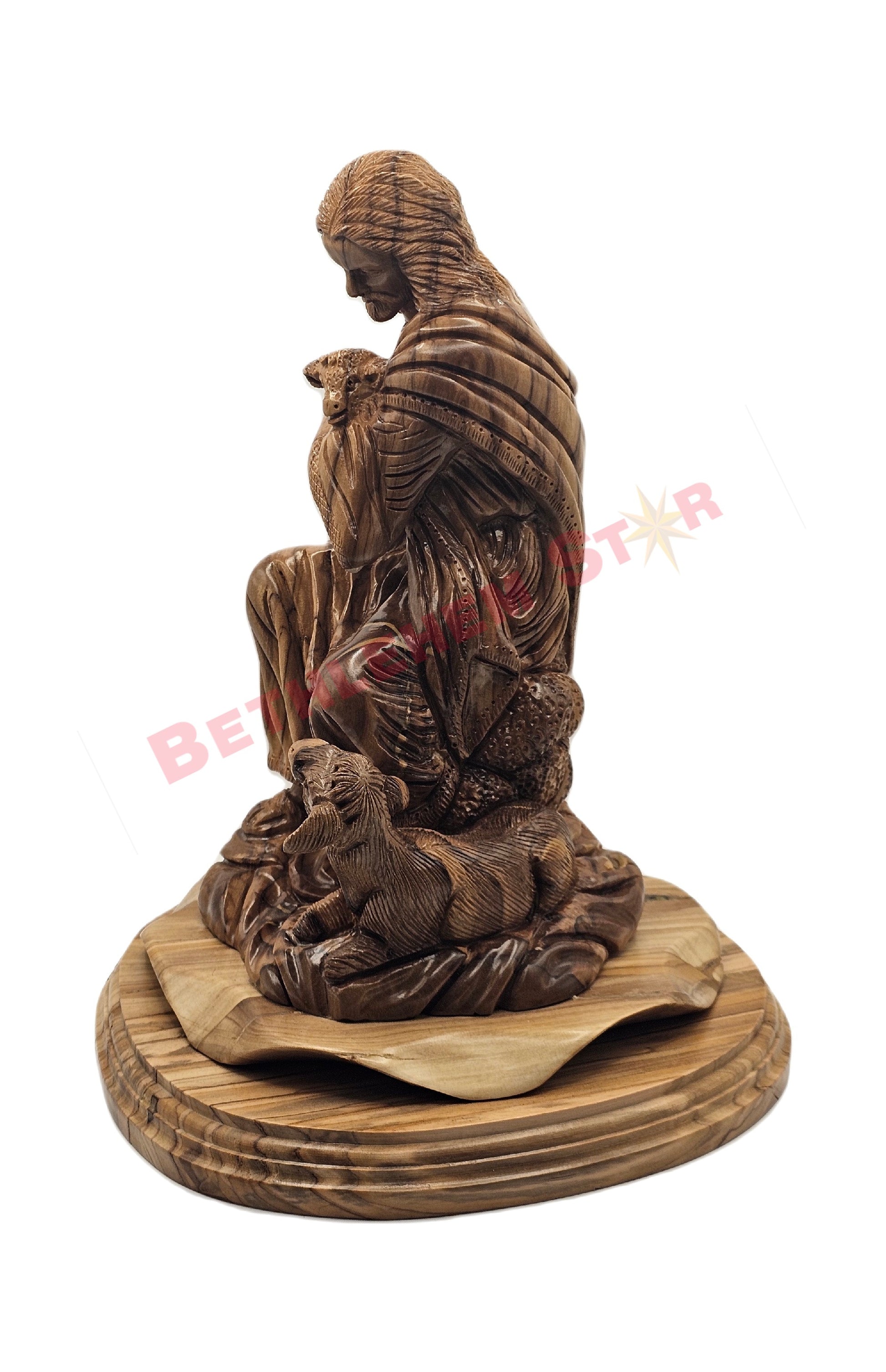 Olive wood hand carved of The Good Shepherd resting on rock