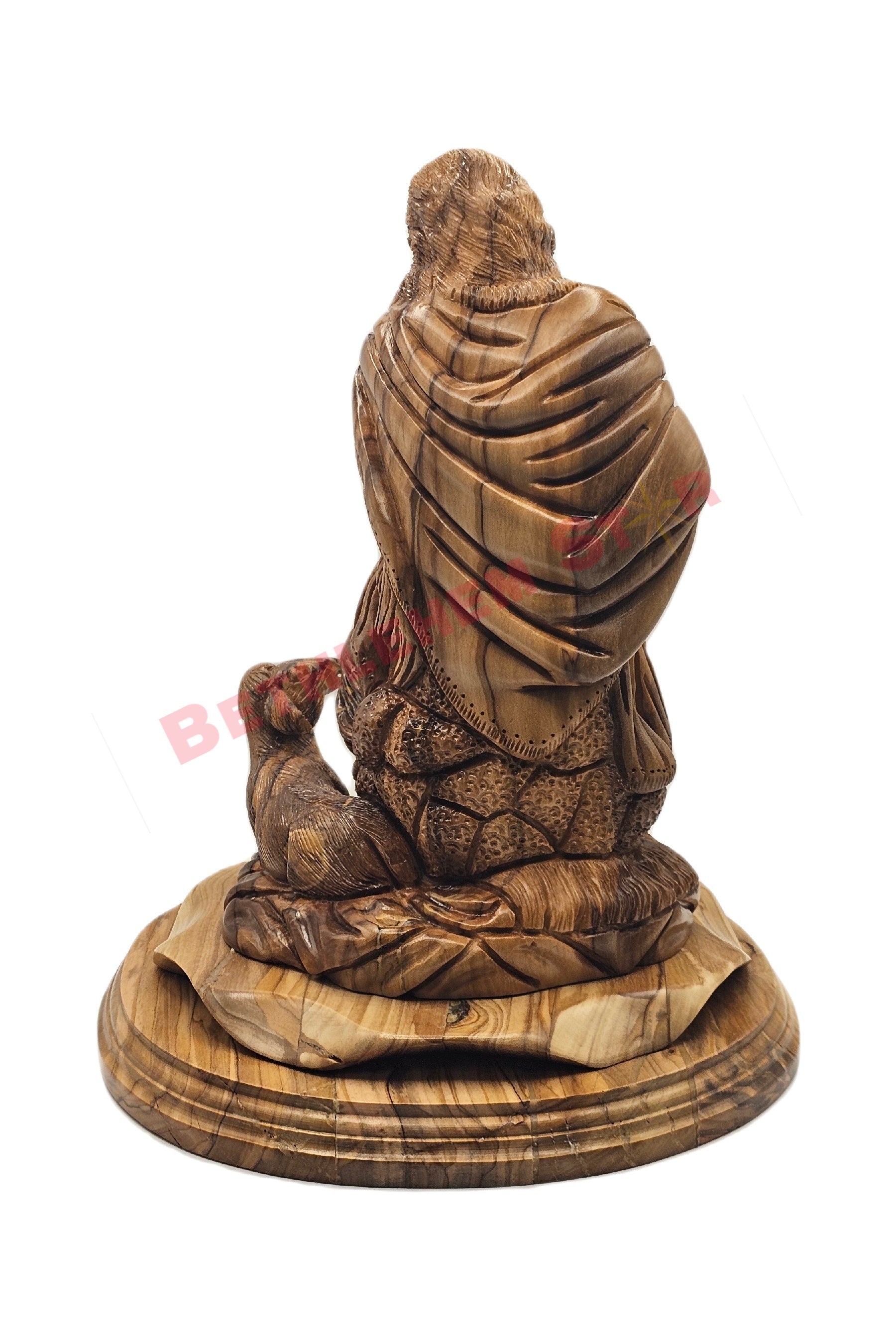 Olive wood hand carved of The Good Shepherd resting on rock